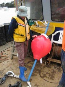 The Admiral inspecting new windy bouy, soft on hull. 